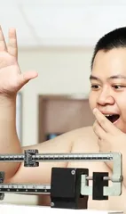 A British man is too fat and is teased by his brother, angry about losing weight