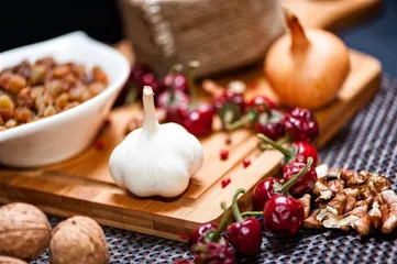 What is the operation of soaking garlic in vinegar?
